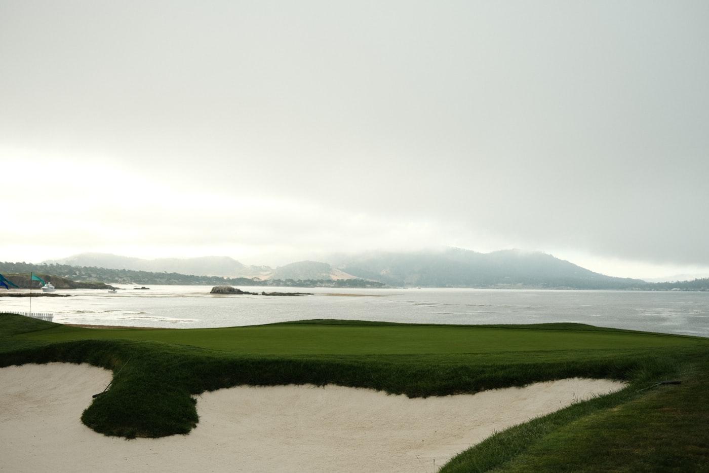An oceanside golf course meeting the coastline